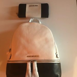 Both book bag and wallet together